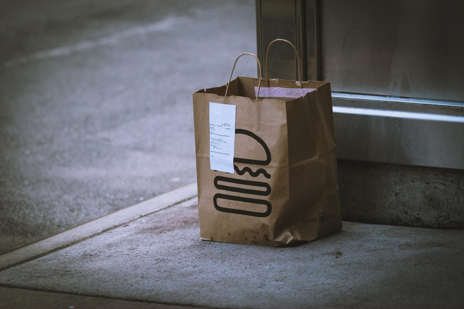 a brown paper bag on a window sill