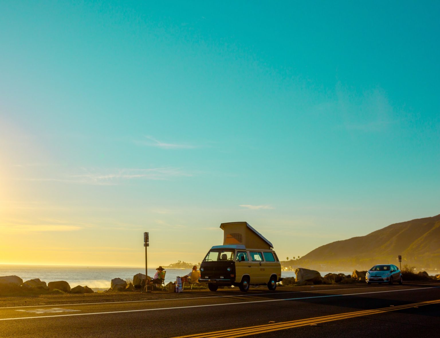 a yellow van on a road