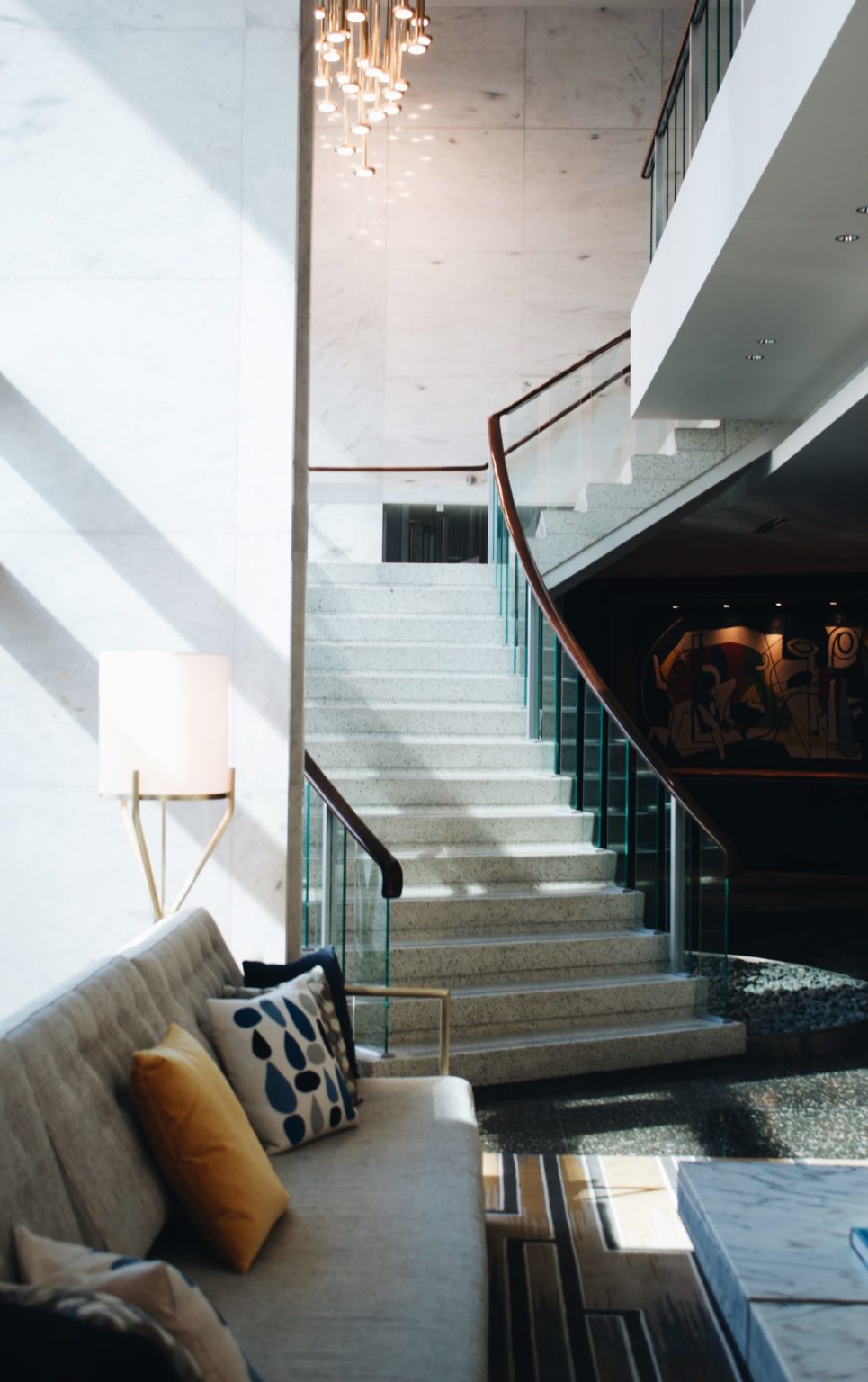 a staircase with a couch and a couch in a house