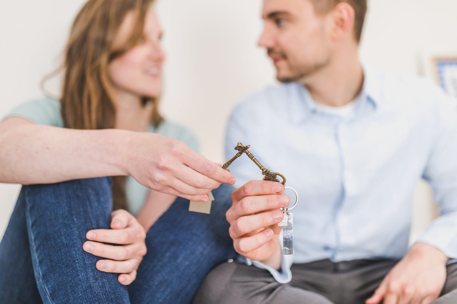 a man and a woman holding a glass of water